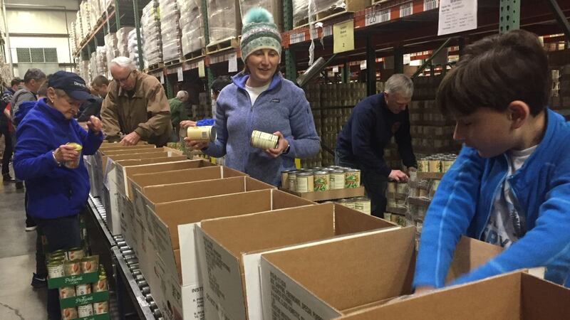 Shifts of 75 people rotated out all day to create 4,500 Thanksgiving baskets. (Photo:...