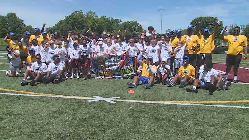 Former UK running back JoJo Kemp (front row, blue hat) hosted his Change the Game" youth...