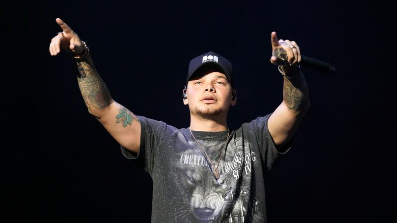 Kane Brown performs during the US99 Stars and Strings concert at the Allstate Arena on Sunday,...