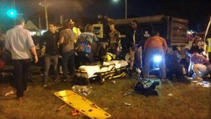 New Orleans police said at least 12 were injured when a car ran into a crowd along a parade...